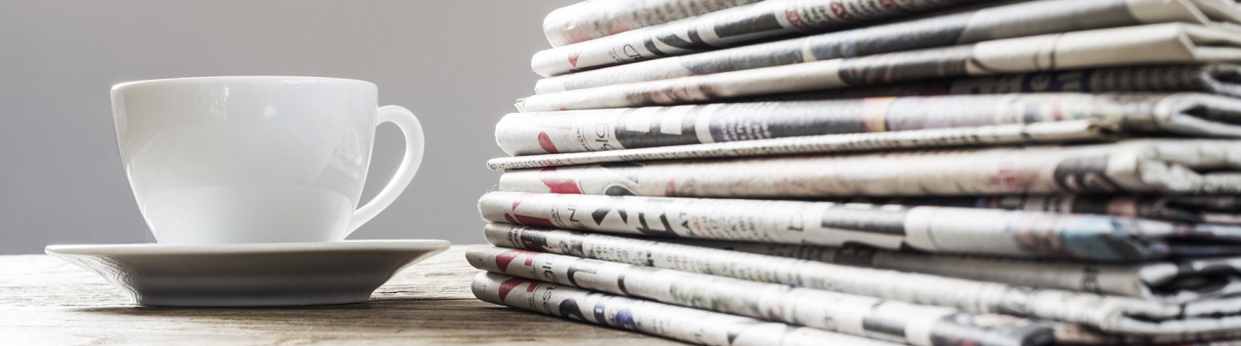 Photo of cup with newspapers